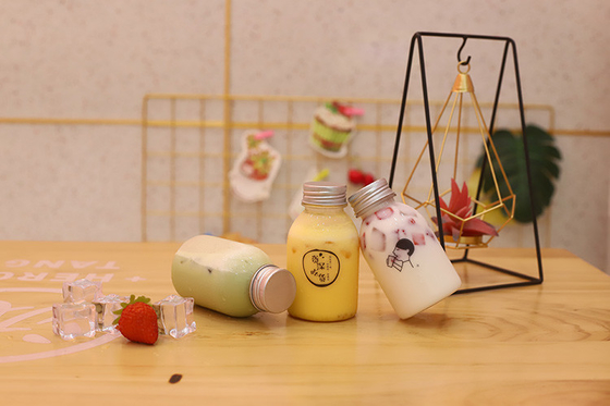 Botol Teh Susu Plastik dengan Genggam untuk Minum dengan Bahan dan Efisiensi